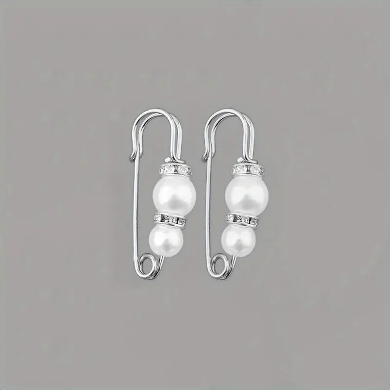 Broches ajustadores de ropa